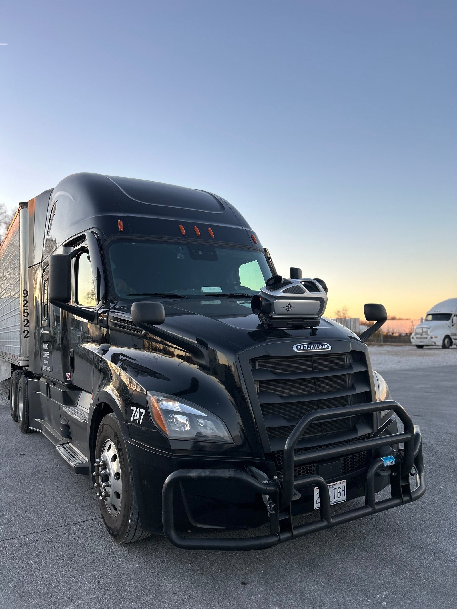 ZERO BREEZE Mark 3 portable air conditioner installed in a semi truck sleeper cab with exhaust hose vented through the window